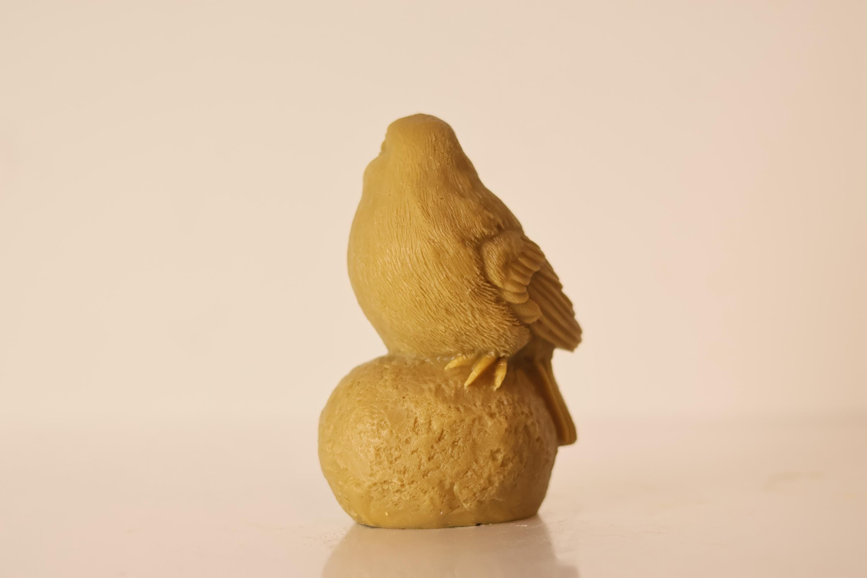 Sitting on Stone Bird Candle